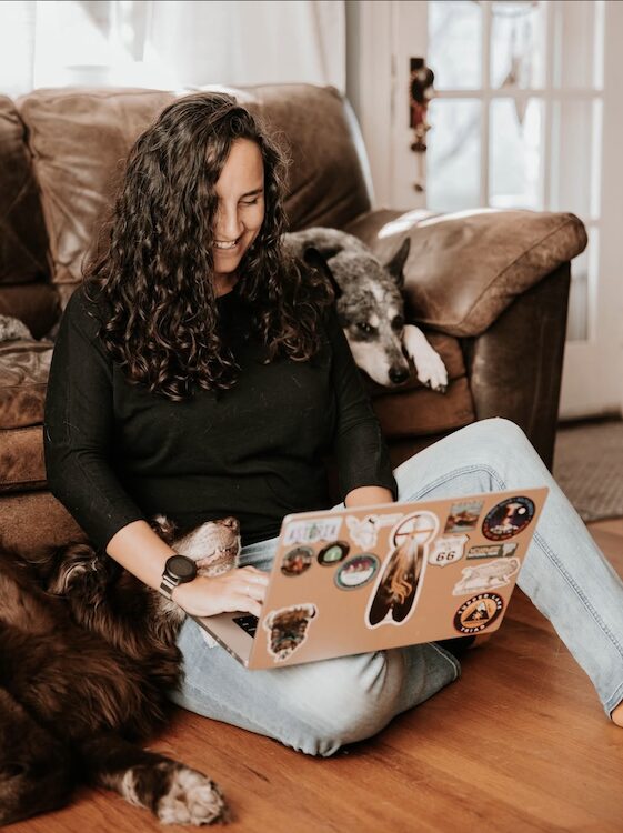 Kati Haynes of Haynes Marketing + Media working at home with dog in the Hudson Valley.