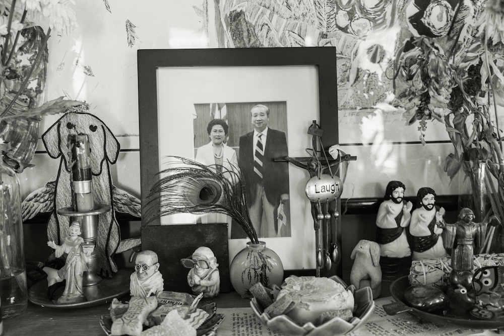 family photos in an alter by Ocean Vuong