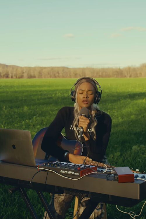 R&B artist Law playing keyboard and singing R&B out in nature in the Hudson Valley NY