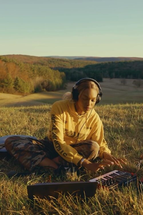R&B artist Law playing keyboard and singing R&B out in nature in the Hudson Valley NY