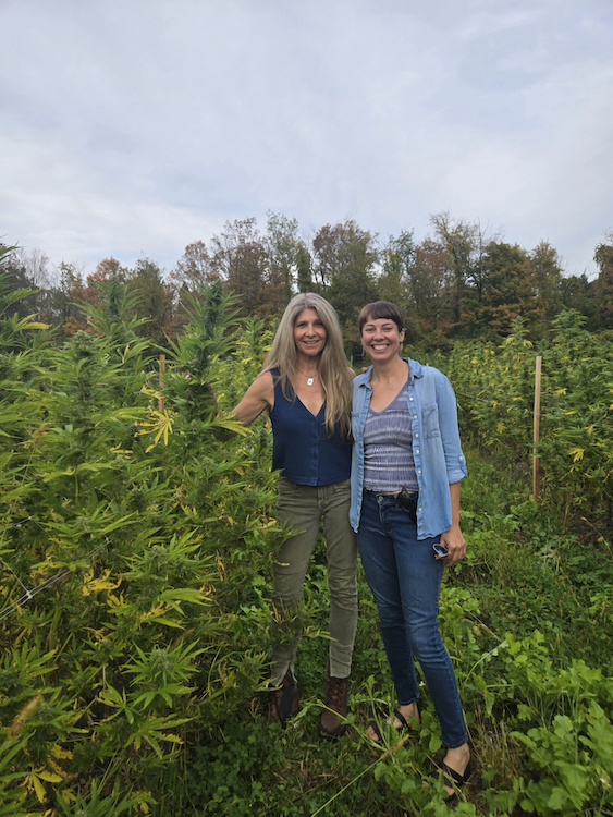 Herbal Woodstock Co-founders Melissa Gibson and Courtney Beaupre in Cannabis garden.