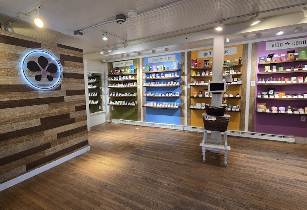 Wall of wood and product inside Herbal Woodstock Cannabis Dispensary in Woodstock, NY.