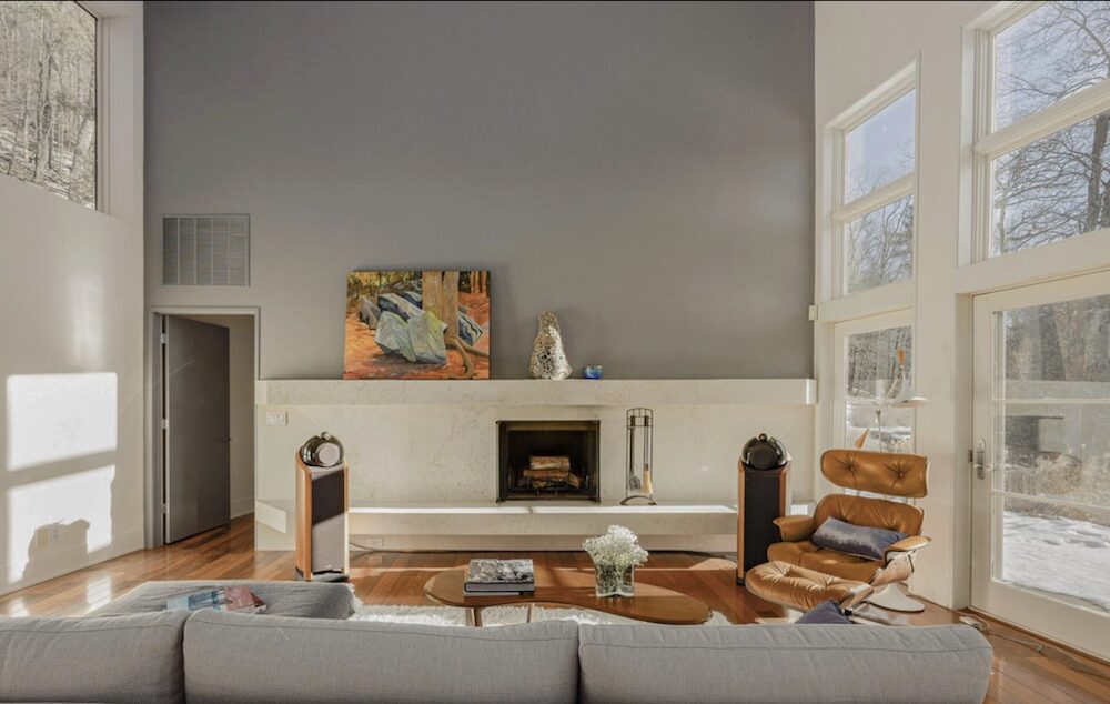 The primary suite features walls of glass, a spa bath with soaking tub and shower, a private balcony, and access to a tranquil sleeping porch. Additional bedroom suites offer refined baths, garden access, and a steam shower retreat.