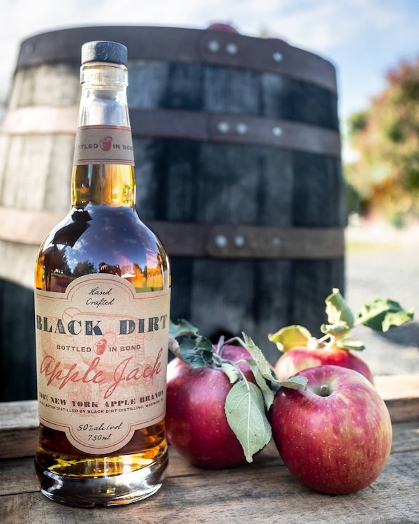 apple jack with apples on a barrel by Black Dirt Distillery in Pine Island NY