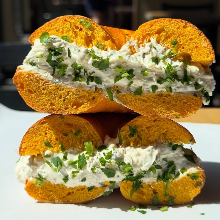 cut open cream cheese and chives bagel at Broad Street Bagels in Kinderhook NY