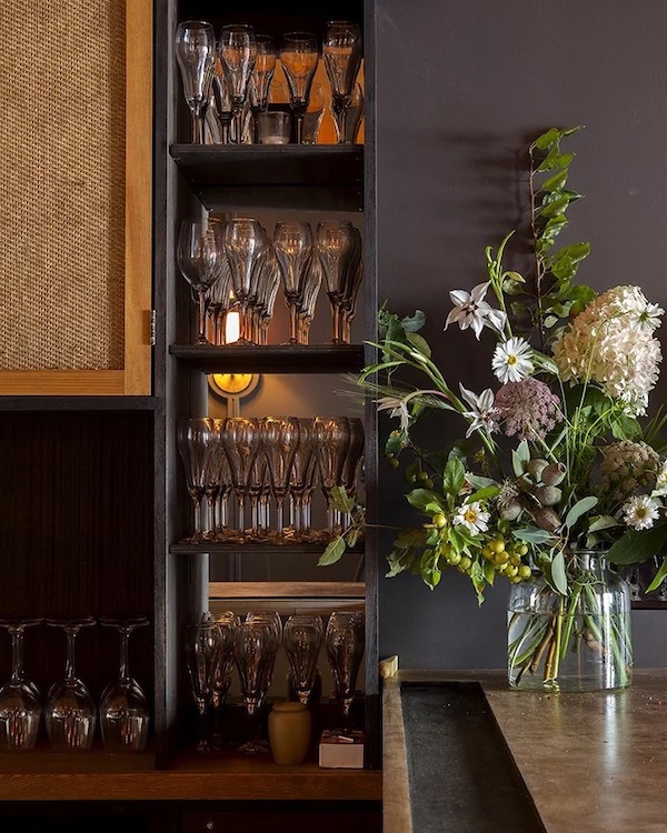 tavern bar and flowers at Rivertown Lodge in Hudson NY