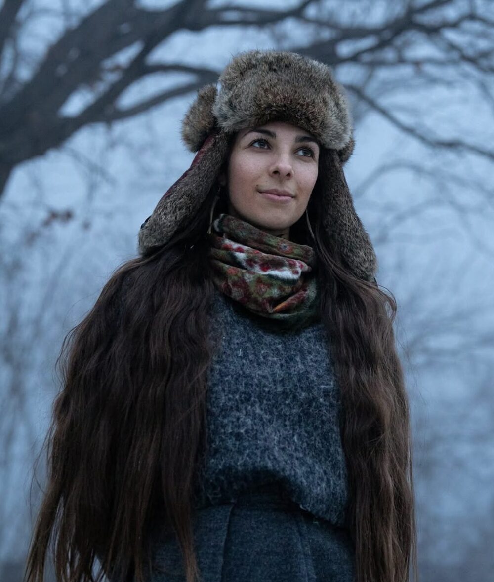 Sasha outside at dusk in the winter for the Pysanky Workshop for Ukraine by Sasha Botanica