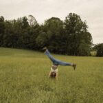outdoor fun doing cartwheels in a grassy meadow
