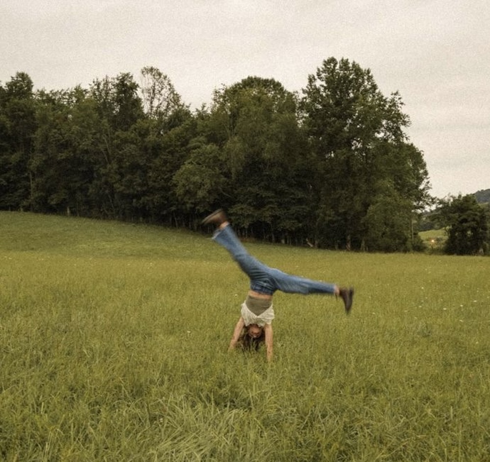 outdoor fun doing cartwheels in a grassy meadow