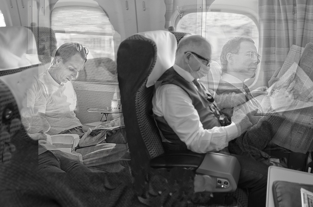 men on a train reading