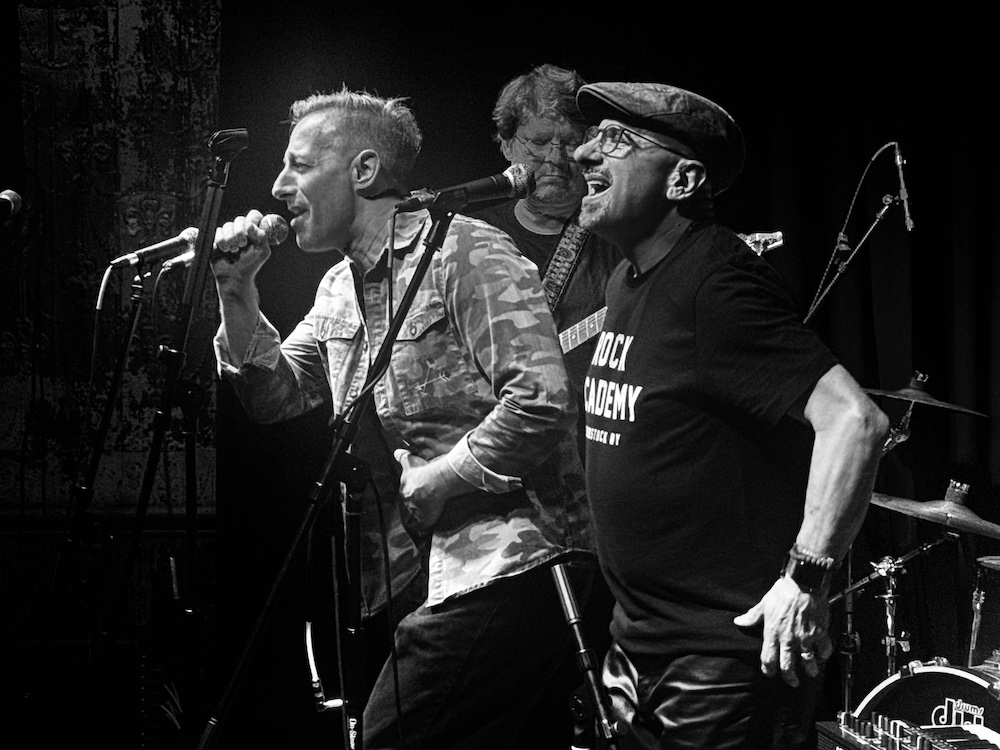 men singing on stage for Rock Academy 
