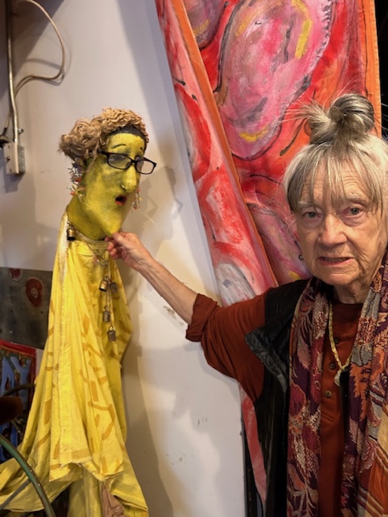 Amy Trompetter holding one of her puppet creations