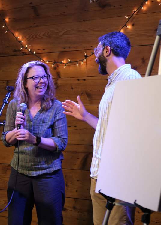 Melissa, Stewardship Manager and Executive Director Andy Mossey on stage at Vernal Fling 2025