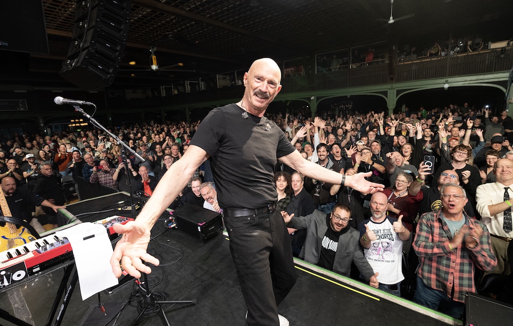 Tony Levin posing for a photo with the crowd at the BEAT tour show in NH
