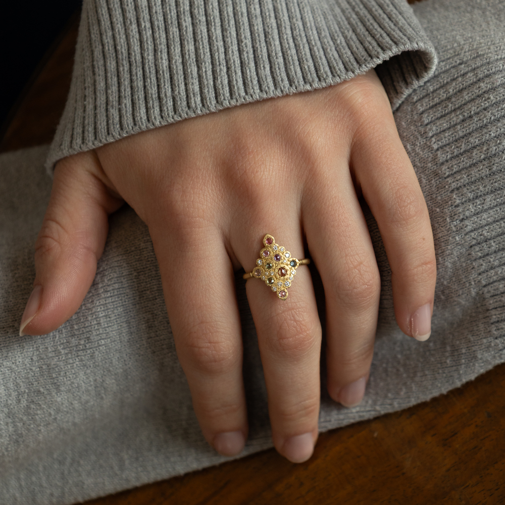 Hand with ring on middle finger. Adel Chefridi Studio + Gallery in Rhinebeck, NY.