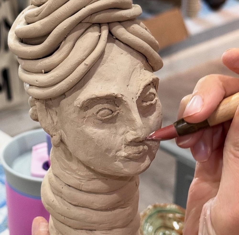 carving clay at Hudson Valley Pottery