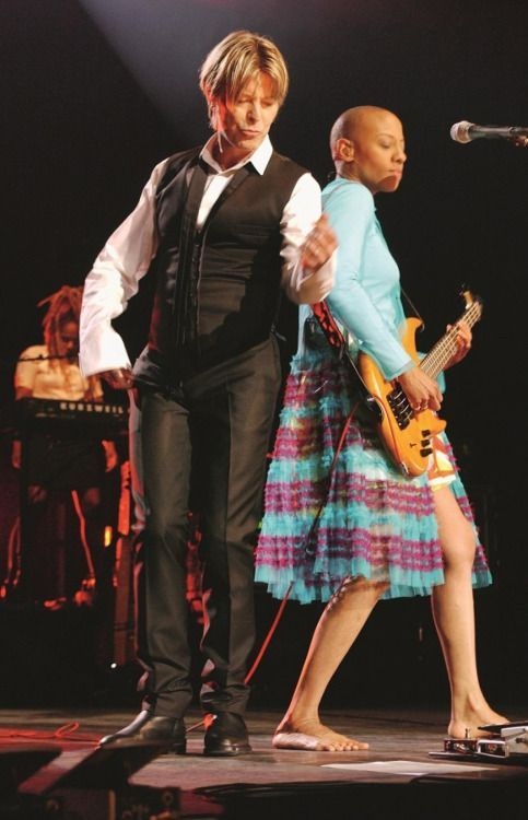 David Bowie and Gail Ann Dorsey dancing on stage