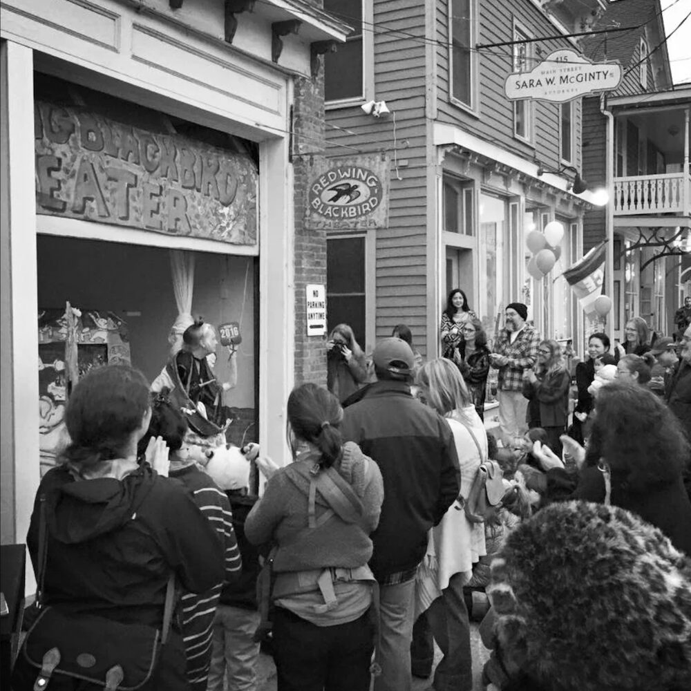 B&W image of a crowd watching a performance at Redwing Blackbird Theater in Rosendale NY