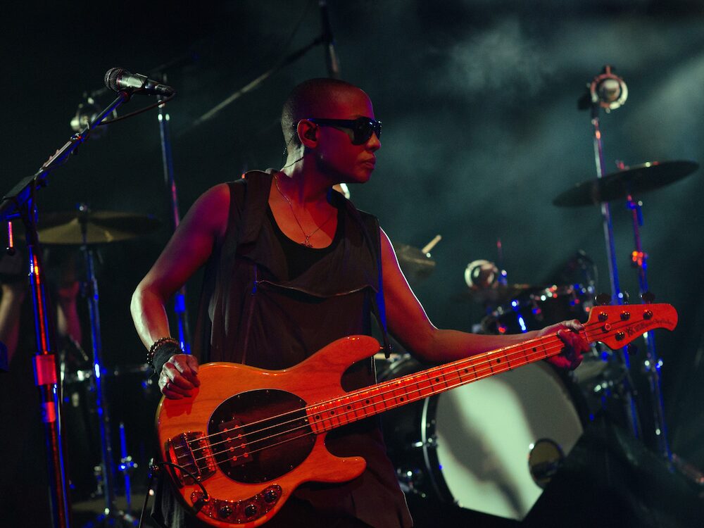 Gail Ann Dorsey on stage playing bass guitar for Lenny Kravitz tour in 2011