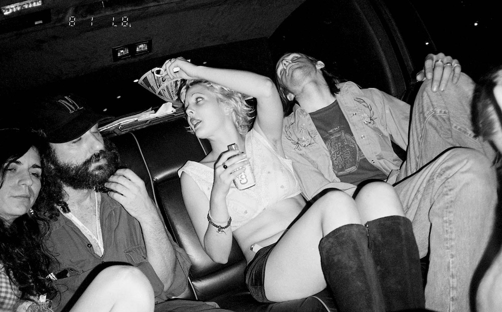 Hal Willner, Drew Barrymore, and friends in limo, NYC, 1995. © Melissa Auf der Maur