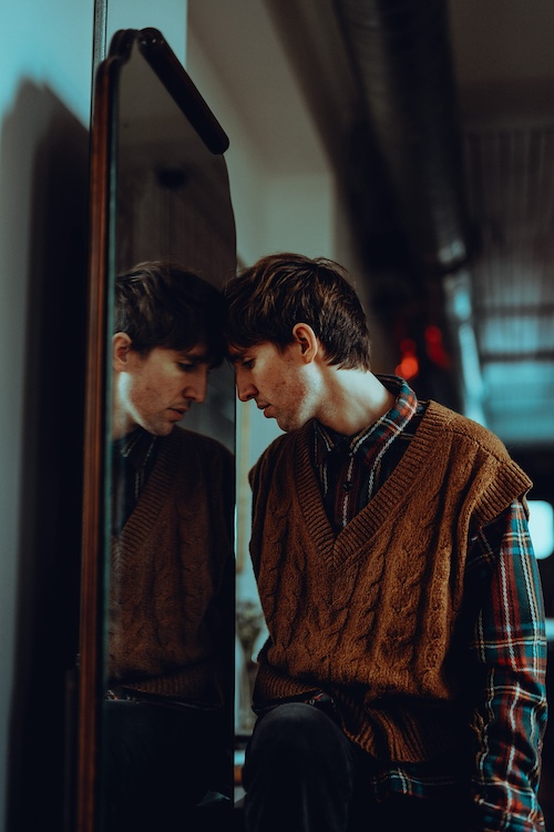 Jack Manley head against a mirror