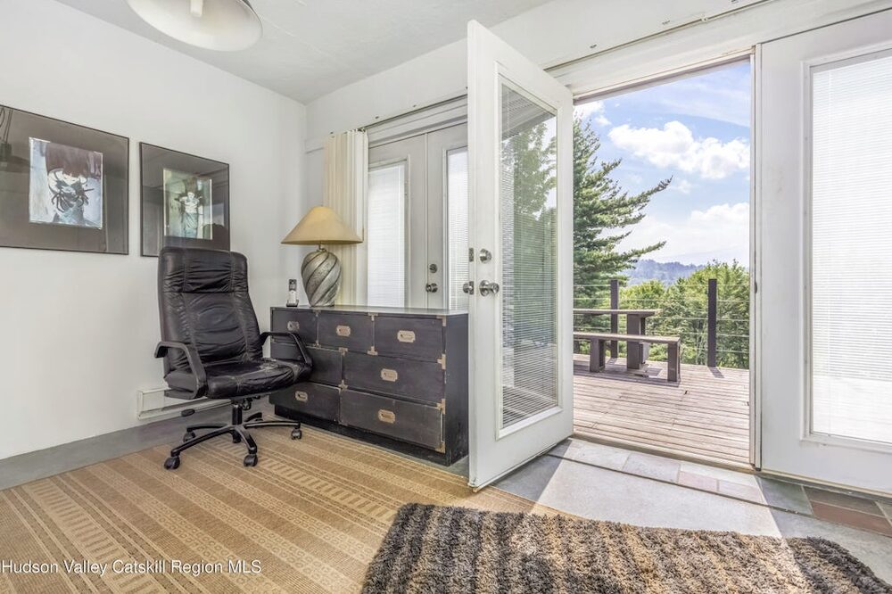 office chair with open door out ot the balcony at 166 Todd Hill Road, West Kill NY