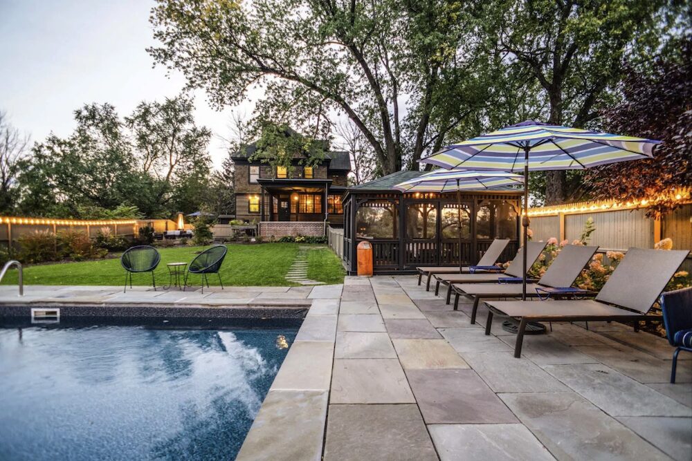 pool deck and lounge chairs with umbrellas at 4174 Route 9W, Saugerties NY