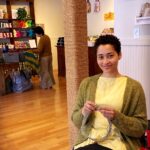 a woman knitting at The Knitting Room