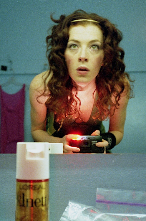 Melissa Auf der Maur taking her own selfie in the mirror backstage in 1998