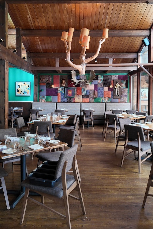 The main dining room with tables and chairs at Peekamoose Restaurant & Taproom in Big Indian NY