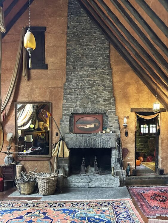 A stone fireplace stretching to the ceiling.