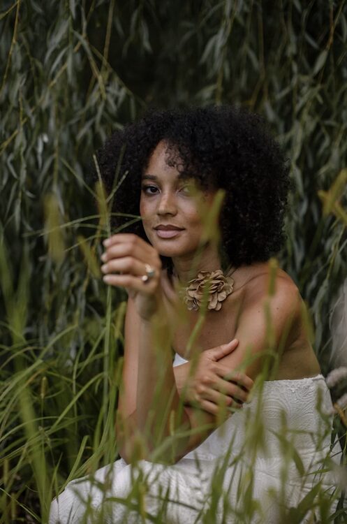 Portrait of woman in the grass by photographer Peter Crosby