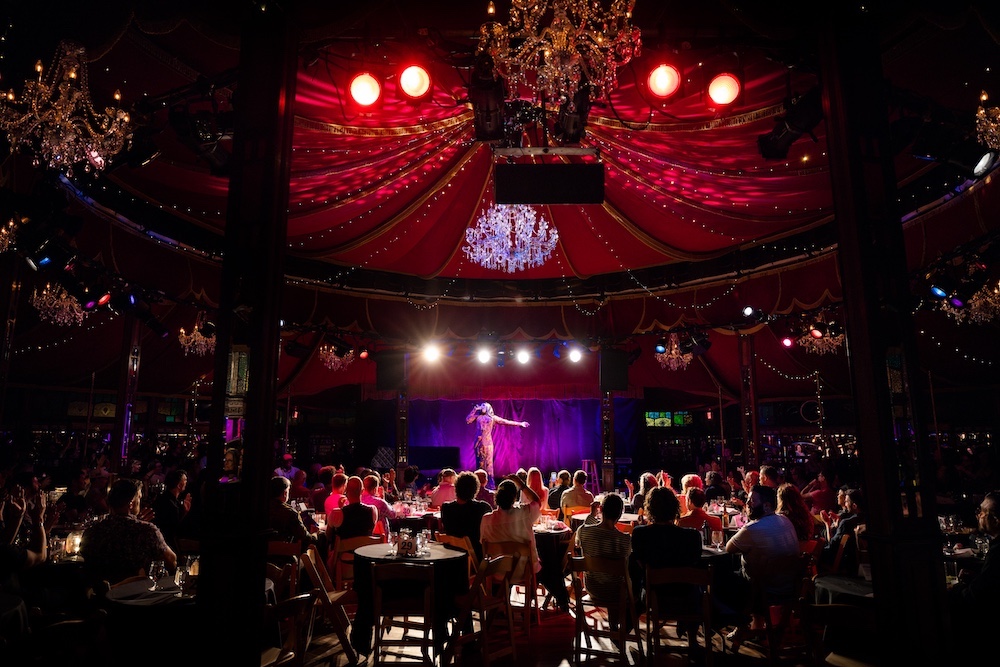 people watching a performer on stage at Speigltent at the Fisher Center Photo by Maria Baranova