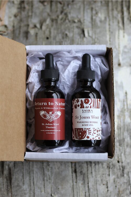 Two dropper bottles in a box. One is St John's wort tincture and the other is an oil.