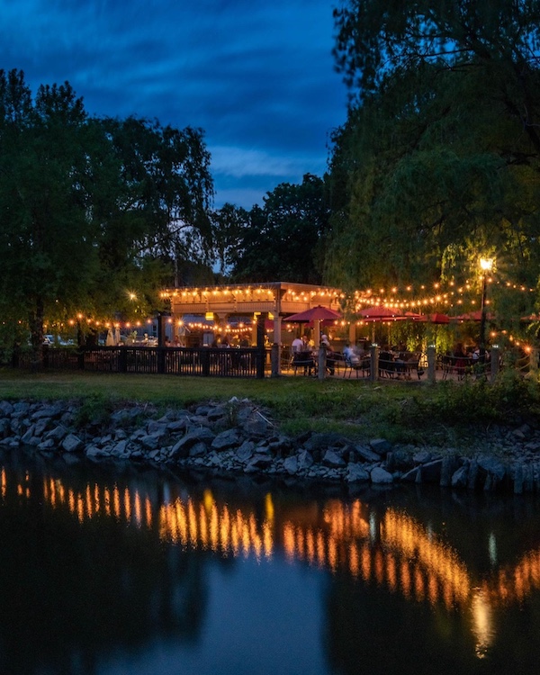 Reflection of the Hudson River at night at the River Grill at Stewart House in Athens NY