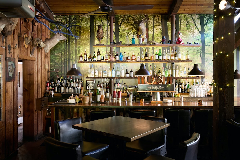 The Taprrom bar, tables and chairs at Peekamoose Restaurant & Taproom in Big Indian NY.