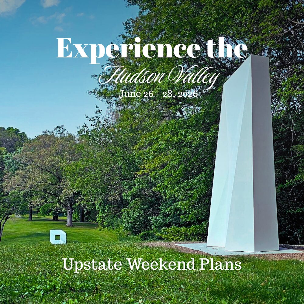 Large white sculpture in the grass with trees and a white cube in the distance at Storm King Art Center in Windsor NY with the "Experience the Hudson Valley" and "Upstate Weekend Plans" text written across the photo.