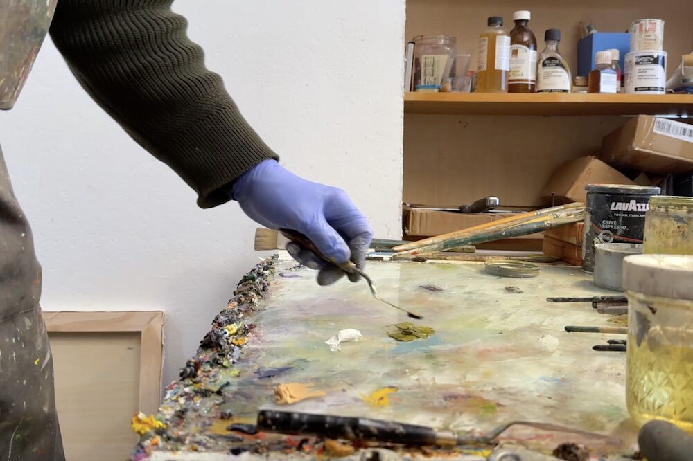 Hudson Valley Artist David Hornung mixing paint