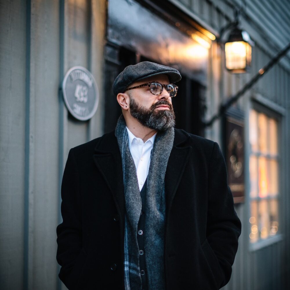 Jeremy Baum on the street in front of a venue.