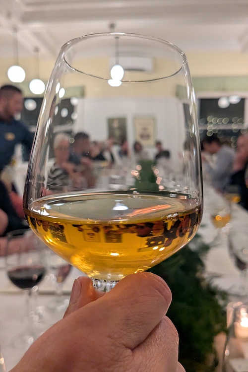 A dessert wine from Italy in a glass at Hudson Valley Wine Dinners at Mohonk Mountain House in New Paltz NY.
