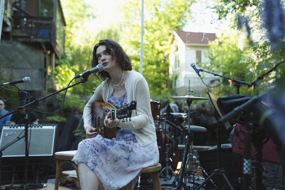 Ginger Winn singing on stage at the 2026 Waterfall Sessions III