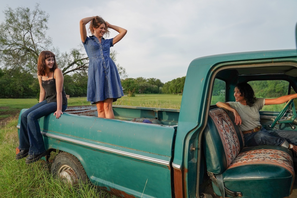 Guthrie Family Singers in a truck in the country.
