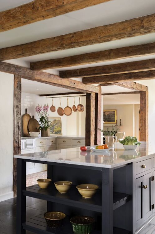 A kitchen island counter with flowers at 809 North Quaker Hill Road, Pawling NY