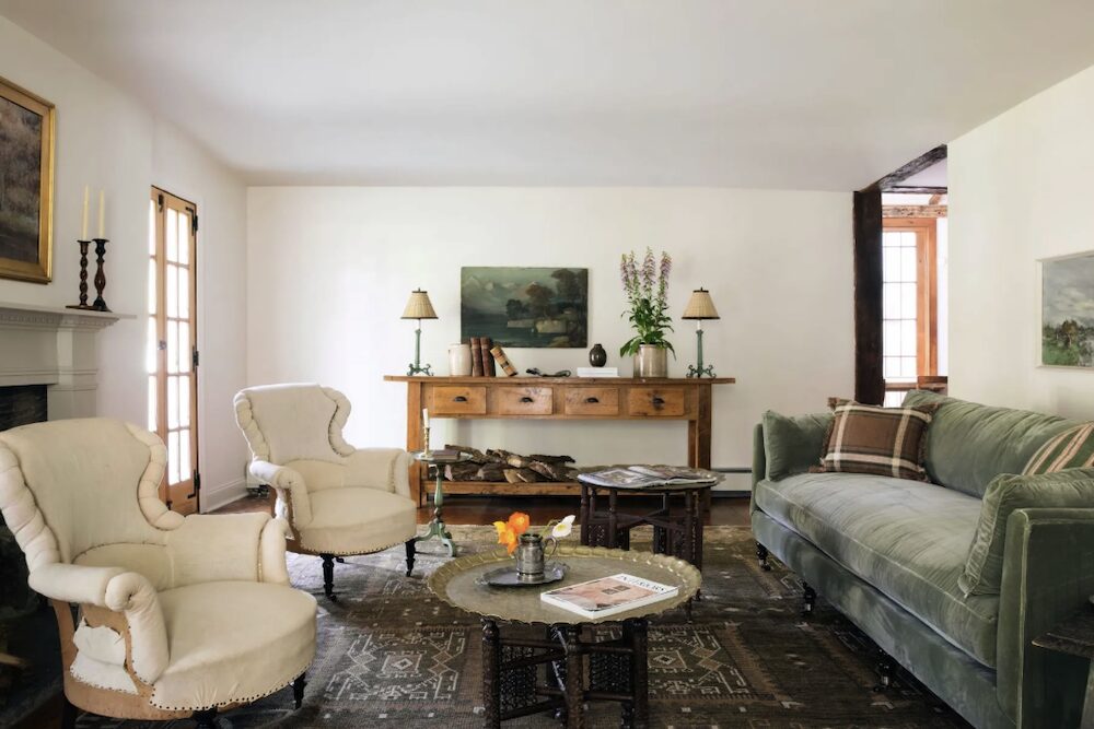 Full view of living room with furniture and fireplace of the kitchen sink at 809 North Quaker Hill Road, Pawling NY.