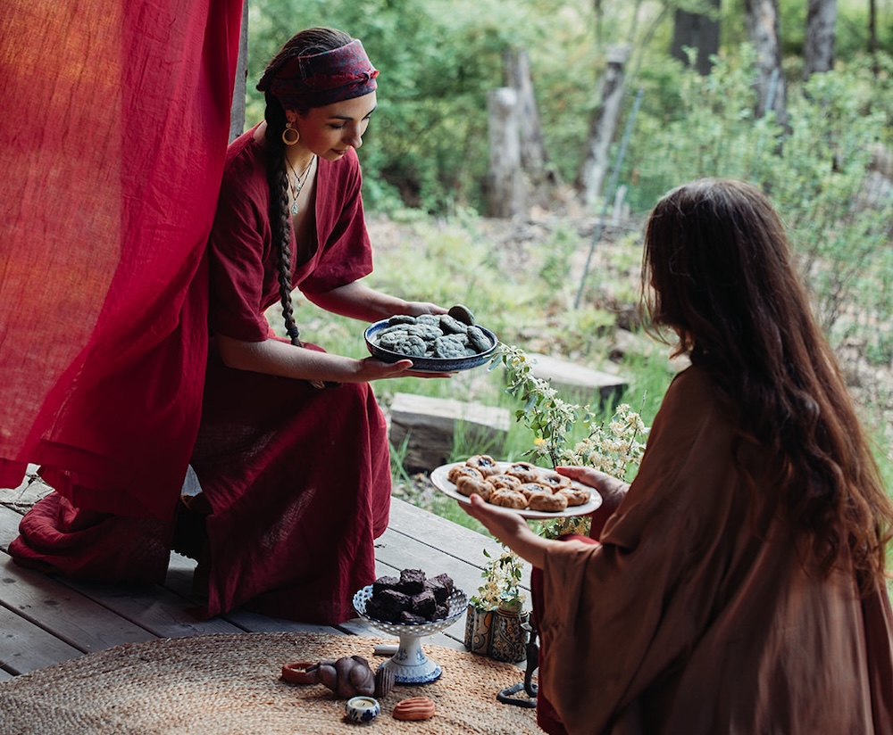 The Red Tent two women sharing food in the tent