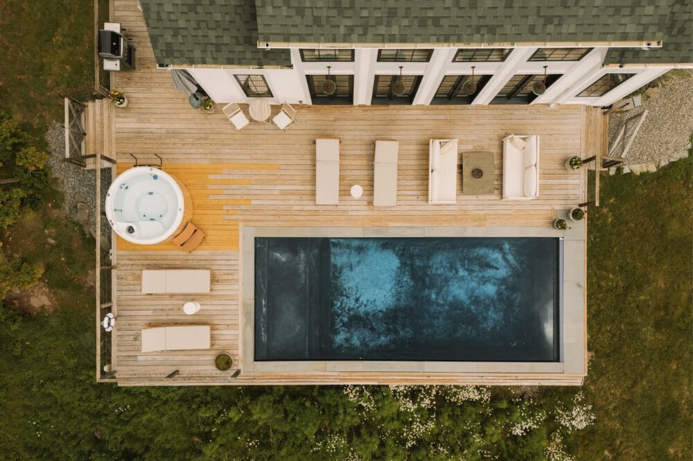 An aerial view of the pool and hot tub at 648 Scudder Hill Rd, Roxbury NY.