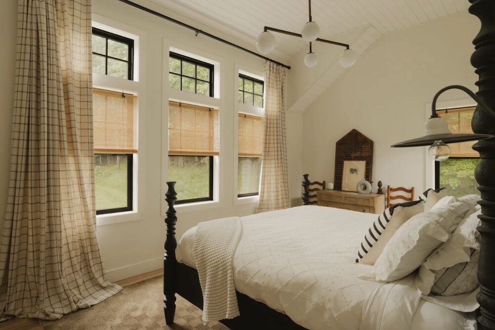Bedroom view of bed and windows at 648 Scudder Hill Rd, Roxbury NY.