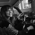 Fiona Dourif driving in a car.