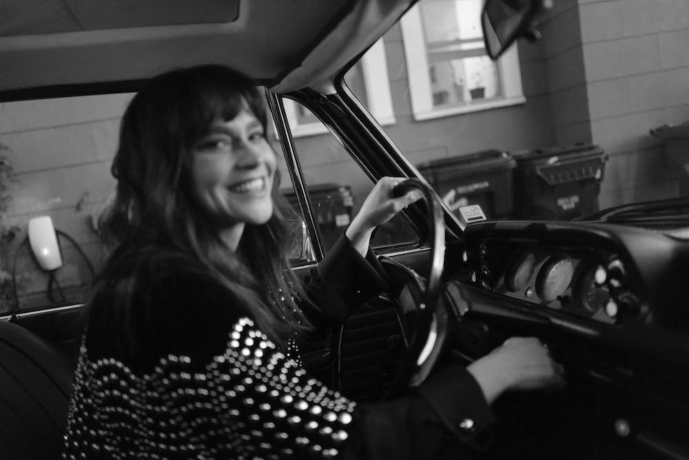 Fiona Dourif driving in a car.