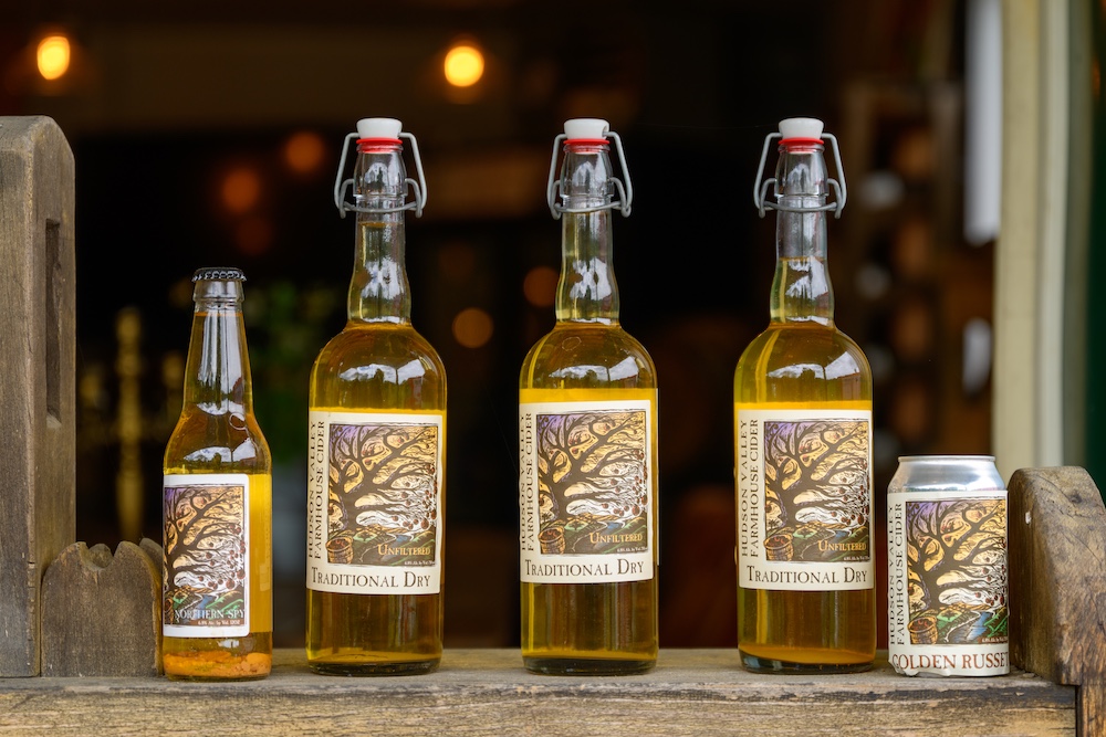Multiple unfiltered ciders at Stone Ridge Orchard.